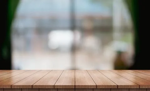 Empty wooden table top with lights bokeh on blur restaurant background (4) Photos