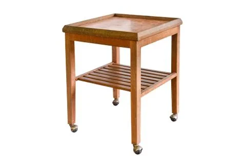 Empty wooden table with wheels isolated. Stock Photos
