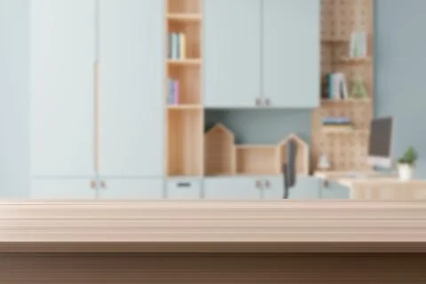 An empty wooden tabletop foregrounds a softly blurred child's learning space Stock Illustration
