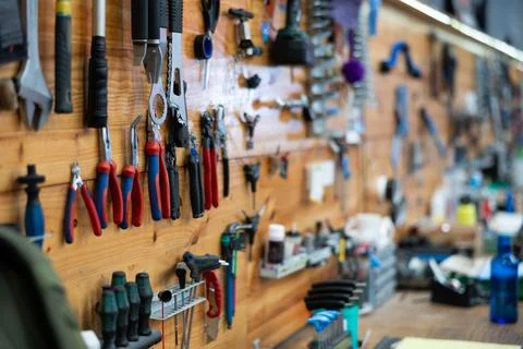 Empty workshop for bike repair with table with different tools Stock Photos