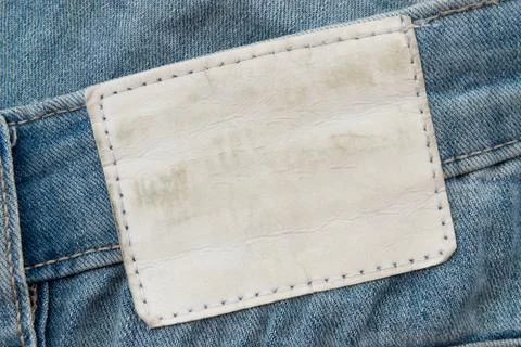Empty worn leather patch on blue jeans. Empty space for writing. Blank leat.. Stock Photos