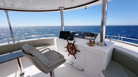 Empty yacht upper deck bridge interior with steering wheel and control panel 스톡 동영상 341376604