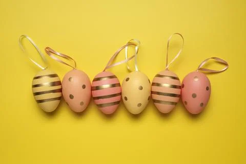 Empty yellow background with Easter eggs Фото