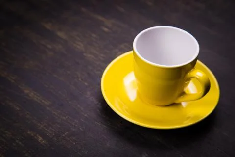 Empty yellow cup Stock Photos