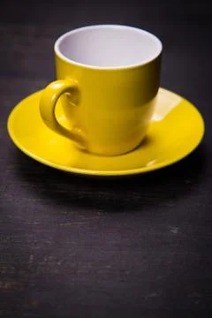 Empty yellow cup Stock Photos