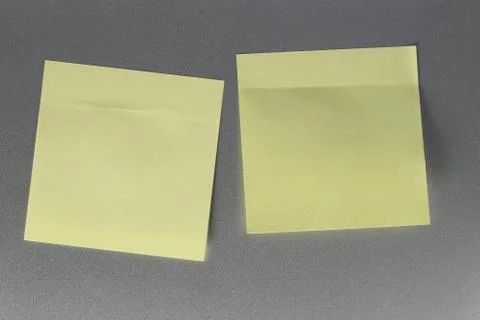 Empty yellow paper sheet on refrigerator door for design. Stock Photos