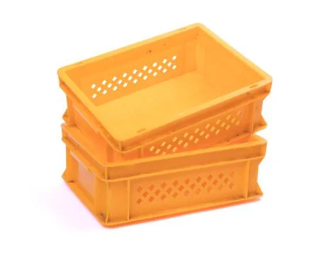 Empty yellow plastic crates Stock Photos