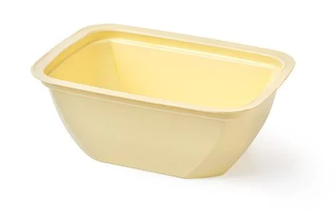 Empty yellow plastic food container for packaging and storage Stock Photos