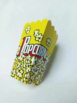Empty yellow popcorn paper box on white background. Stock Photos