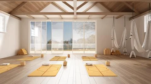 Empty yoga studio interior design, open space with mats, pillows