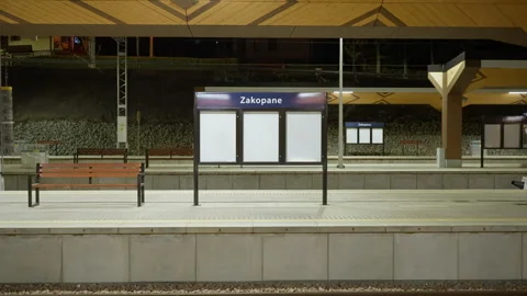 Empty Zakopane station platform with regional wooden design at night Stock Footage 335145366