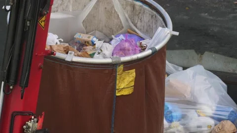 Emptying Big Garbage Container With Crane at Apartment Area 動画素材 229841132