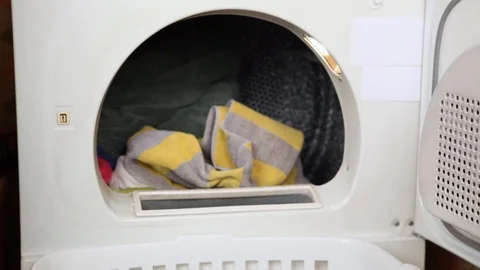 Emptying Clothes Dryer Stock Footage 126724758
