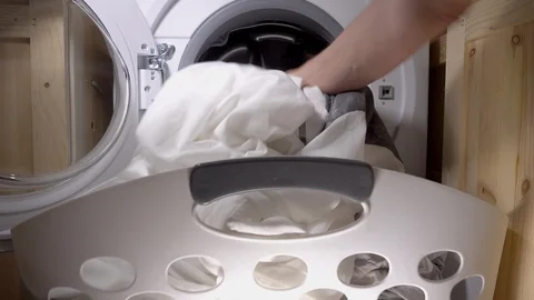 Emptying a modern washing machine. Stock Footage 91858349