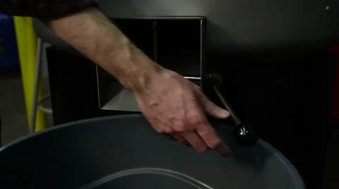 Emptying Roasted Coffee Beans into Container Stock Footage 68151820