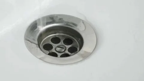 Emptying the water into the sink Stock Footage 69104238