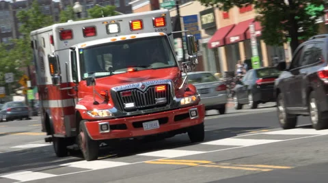 EMS ambulance, Dutch angle, passing Stock Footage 64558437