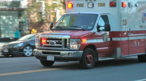 EMS Ambulance passes, turns, siren beeping in Washington, DC Stock Footage