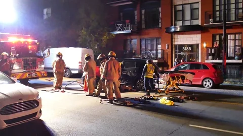 EMS bringing stretcher to transport car accident victim Stock Footage 102016117