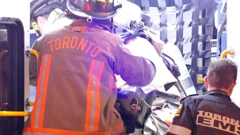 EMS crews desperately work on victim inside ambulance Stock Footage 77895273