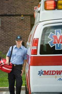 EMT posing in front of ambulance Stock Photos