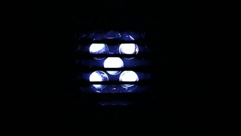 Enabled LED lamp on a black background flickering Stock Footage 135698750