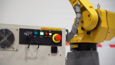 Enabled system unit controls mechanism. Yellow robot manipulator rotates Stock Footage 126355634