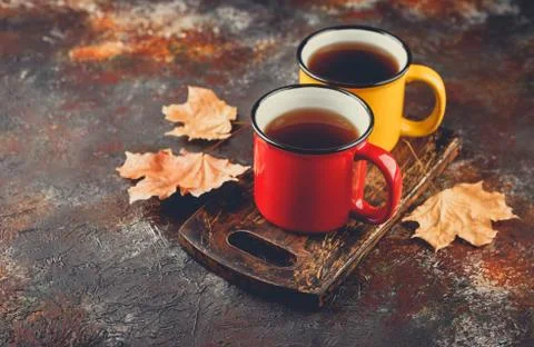 Enameled cup of hot tea Stock Photos
