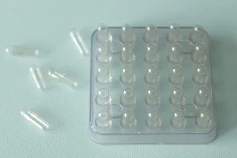 Encapsulator, machine for manually filling capsules with empty pills, 50 piec Stock Photos