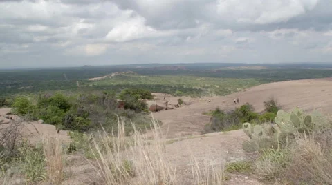 Enchanted Rock Time Lapse 3 Tourists and cactus Stock Footage 49613411
