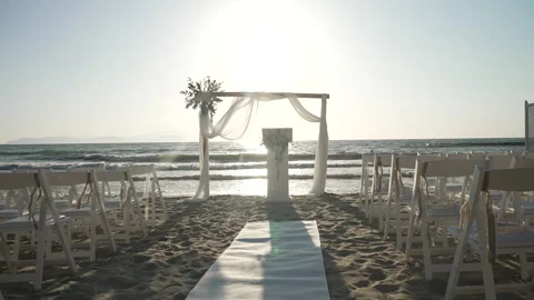 An enchanting beach wedding setup at sunset Stock Footage 323432455