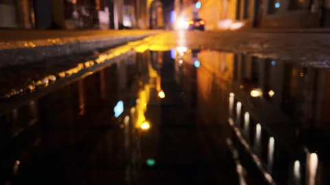 Enchanting cityscape with emergency lights diffused in the aftermath of rain at Stock Footage 261033682