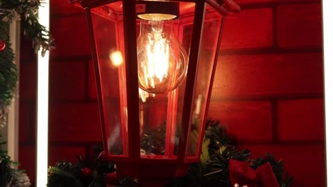 Enchanting red lantern glowing warmly in festive holiday decor 스톡 동영상 296145166