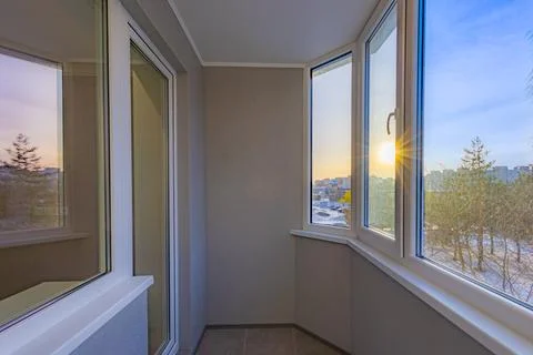 Enclosed balcony interior with sunset light Stockfoto's