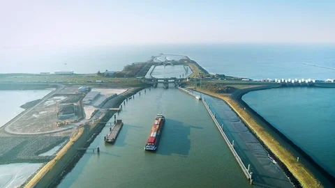 Enclosure Dam (Afsluitdijk): Cargo Ship and Traffic – Netherlands – 4K Drone Stock Footage 127569780