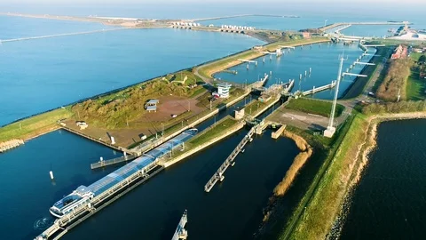Enclosure Dam (Afsluitdijk): Cargo Ship in Sluice - Netherlands – 4K Drone Stock Footage 127569908