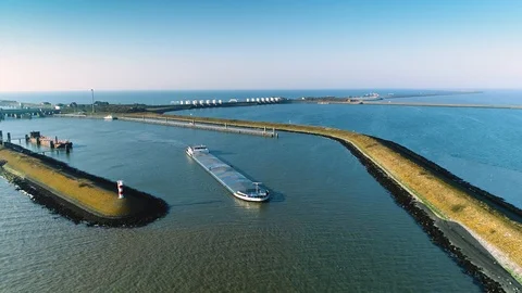Enclosure Dam (Afsluitdijk): Cargo Ship with the Dam - Holland – 4K Drone Video stock 127570687