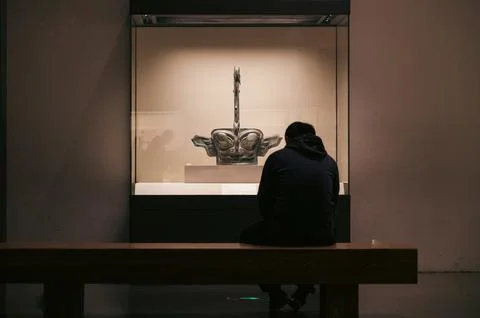Encounter with the Ancient: A Visitor's Reflection on the Bronze Mask Stock Photos