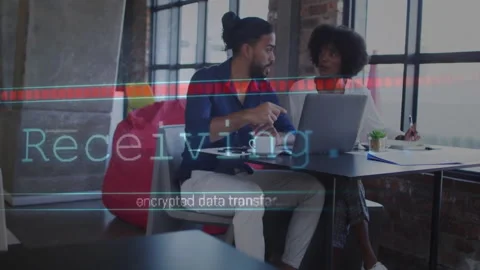 Encrypted data transfer animation over two people discussing work at laptop Stock Footage 303685198