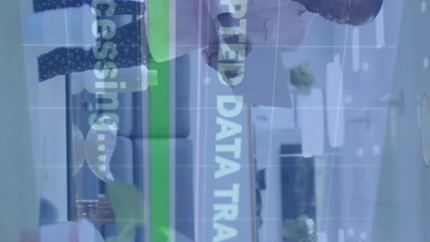 Encrypted data transfer animation over diverse team collaborating in modern Stock Footage 312848910