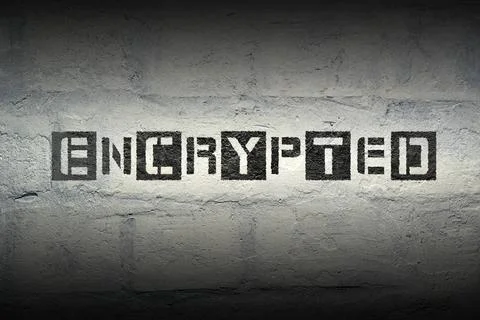 Encrypted WORD GR encrypted stencil print on the grunge white brick wall C... Stock Photos