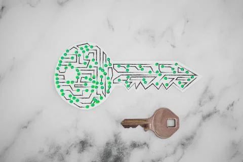 Encryption key icon made of circuits and LED lights next to old metal key Foto stock