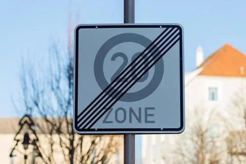 End of 20 km/h speed zone sign on urban street Stock Photos