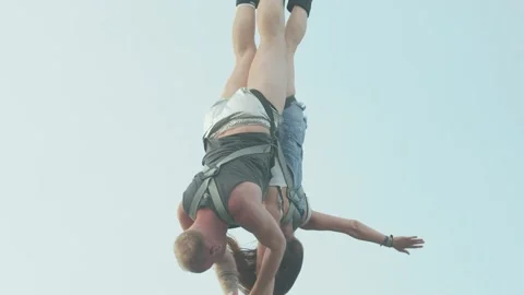 End of a bungee jump of a couple Stock Footage 136173641