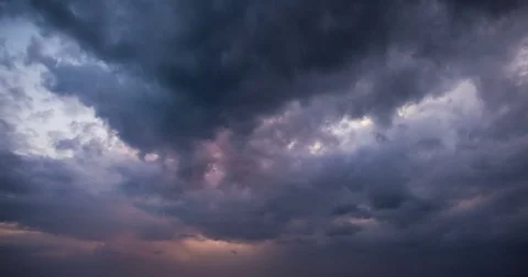 End of the day, the sun sets behind the running clouds Stock Footage 73110990