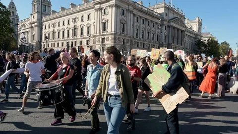 The end of an Extinction Rebellion march as it arrives back at Parliament Squ Stock Footage 121131328