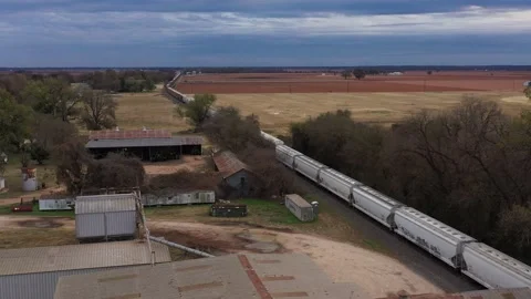 The End of a Freight Train Passing some Old Buildings, Brazos County, Texas, USA Video stock 145947993