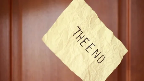 "The End" inscriprion on suspended rumpled sheet Vídeos de archivo 108830001