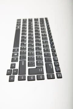 End on oblique angle view of a computer keyboard Stock Photos
