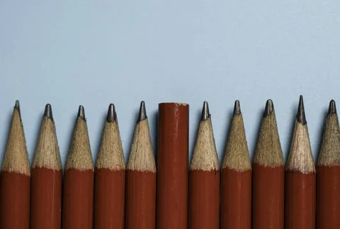 The end of one red pencil is switched to the tip of the red pencil group Stock Photos